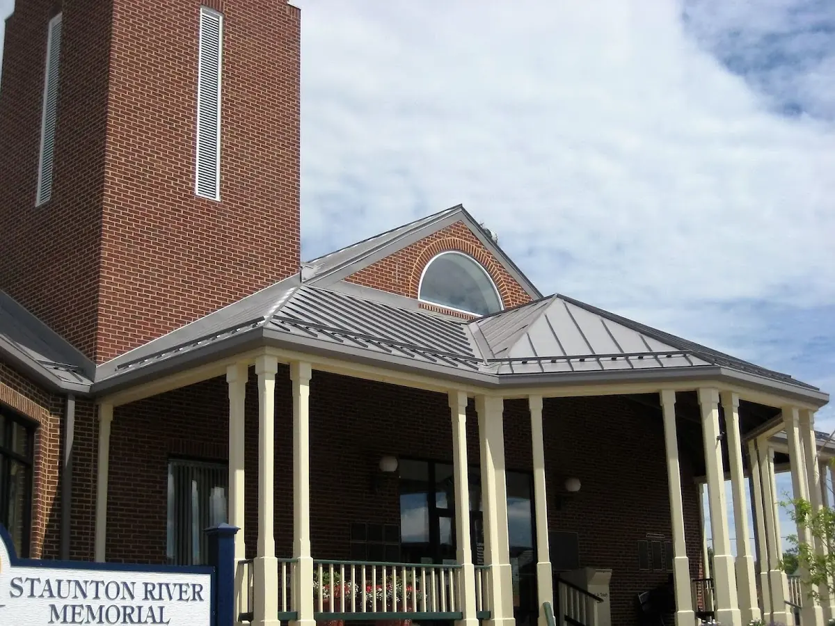 Skilled roofing craftsmen working on a residential roof in Carencro